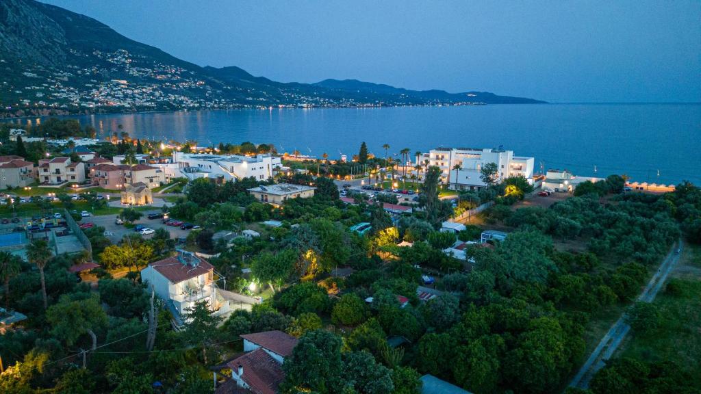Sunset Aerial view of Planet Seaside Apartments in Kalamata, Greece, showcasing five studios with the inviting Kalamata beach and the Messinian gulf, just 150 meters away